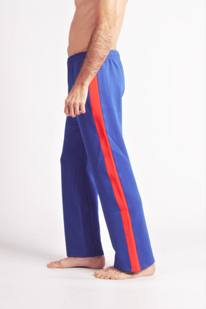 Flying Dance Pants es un pantalón de danza técnico unisex para entrenamiento de baile, danza contemporánea, acrobacia, yoga, artes marciales, pilates y cualquier disciplina vinculada al movimiento. Ideal para el trabajo de suelo, con un tejido resistente, deslizante y super absorbente. Color Azul y Rojo.